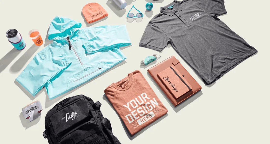 Branded apparel, drinkware, bags and accessories laid out together